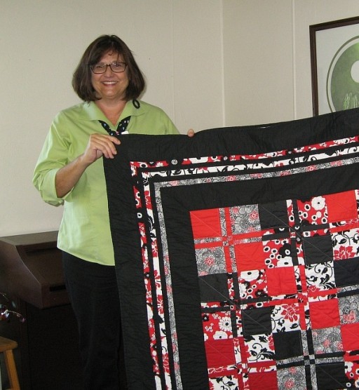 Kris Wagner-Maclean with quilt